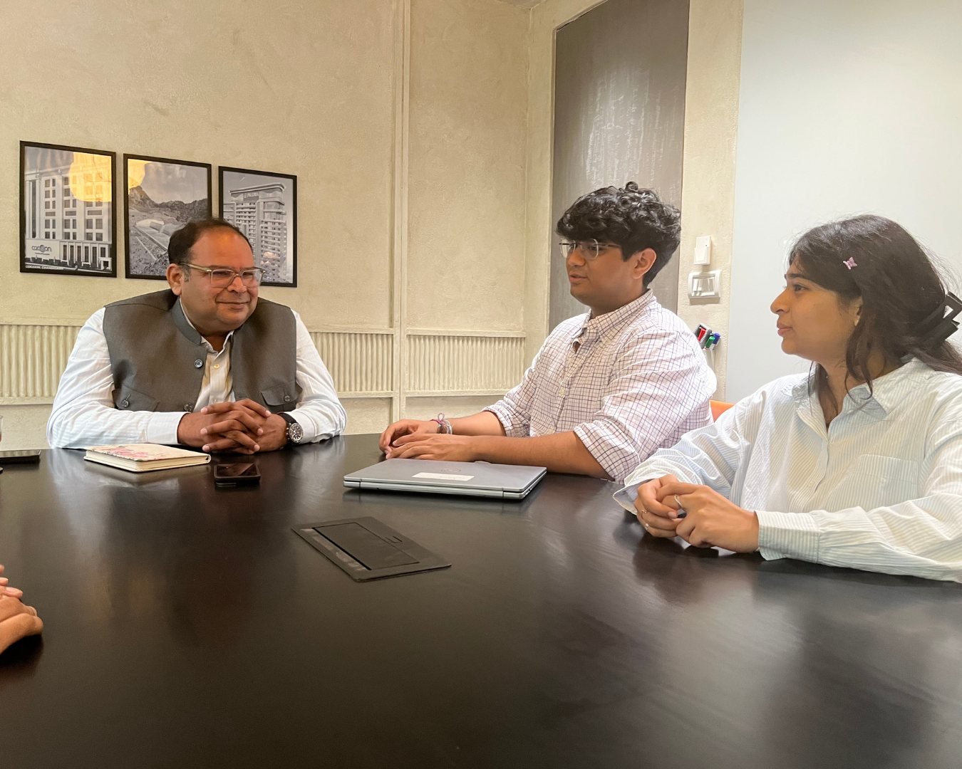 A.K. Jain, founder of Walk The Talk, in conversation with his team